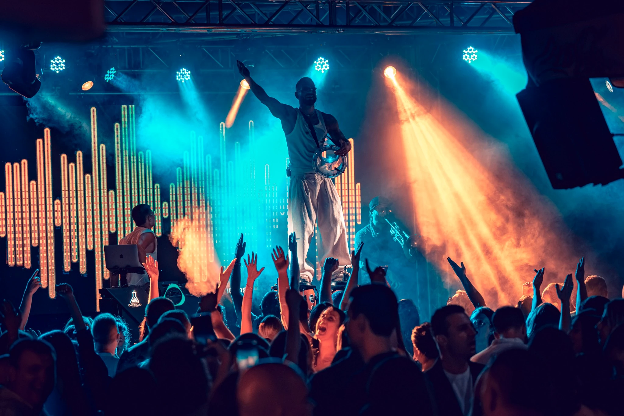 BokaConga performing live on stage in front of a packed crowd